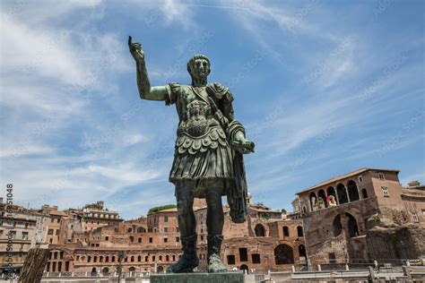 Looking Up At The Statue Of Julius Caesar In Via Dei Fori Imperiali