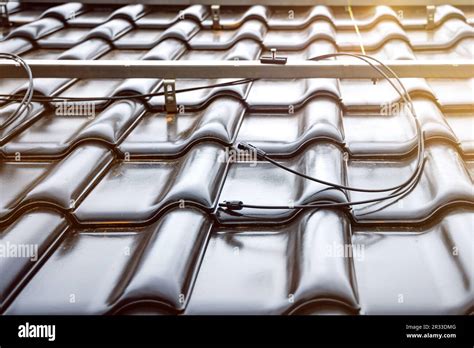 Solar Panel Cables And Mounting System On A Tiled Roof Stock Photo Alamy