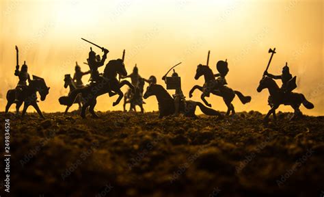 Medieval Battle Scene With Cavalry And Infantry Silhouettes Of Figures