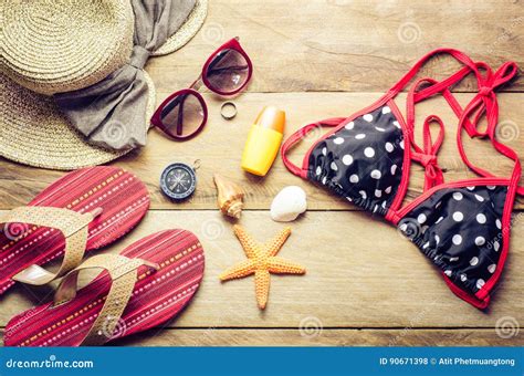 Beauty Colorful Bikini And Accessories On Wooden Floor For Trip Stock