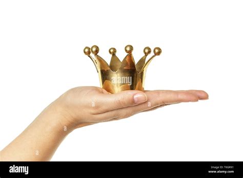 Female Hand Holding A Golden Crown Stock Photo Alamy