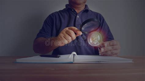 Man Using Magnifying Glass Looking Shining Light Bulb Idea Concept