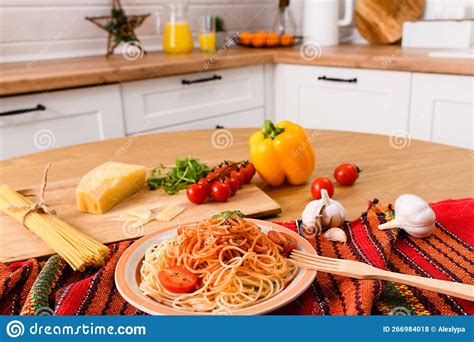 Freshly Cooked Pasta With Tomato And Parmesan Cheese On The Table Stock