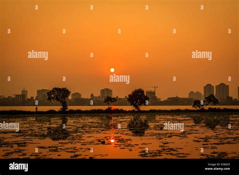 Sunset on West lake, Ho tay, Hanoi, Vietnam Stock Photo - Alamy