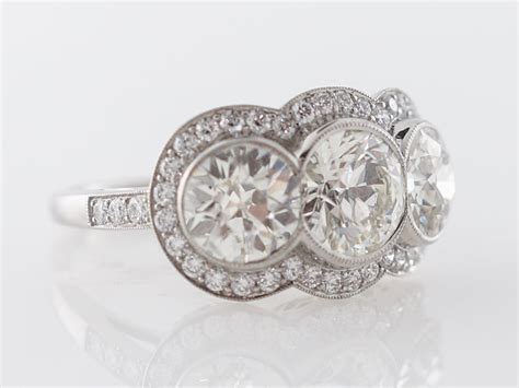 Three Stone Halo Engagement Ring in Platinum - Filigree Jewelers