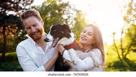 Young Couple Walking Dog Park Stock Photo 767939035 | Shutterstock