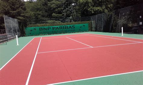 Rénovation d un court de tennis en béton poreux de la BNP PARIBAS à