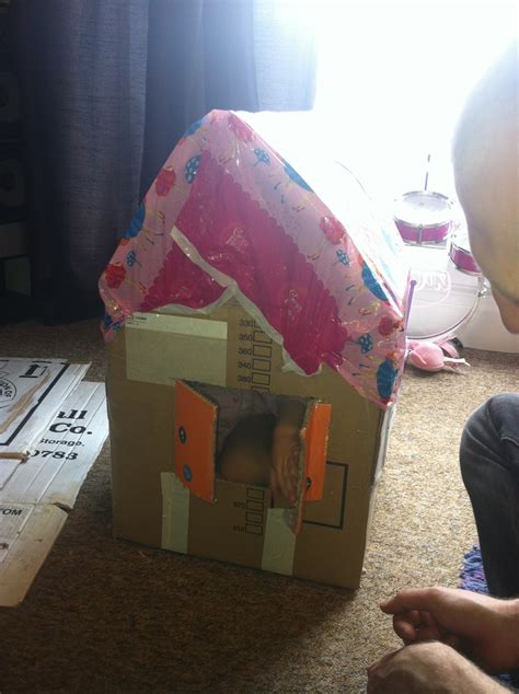 Cardboard box house! They couldn't be happier!