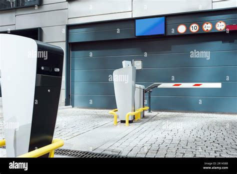 Parking Meters On City Street Near Buildings Stock Photo Alamy
