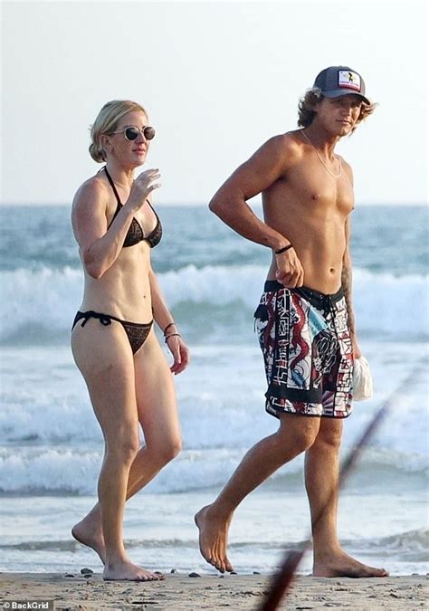 Ellie Goulding's romance with hunky surfing instructor heats up! Singer looks cosy with Armando ...