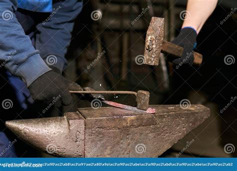 Traditional Metal Forging In A Forge With A Hammer And Chisel Stock