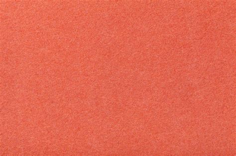 Темно оранжевый матовый замша ткань крупным планом. бархатная текстура ...