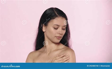 Closeup Studio Shot Of Beautiful Female Model Brunette Girl With Long Hair And Nude Makeup