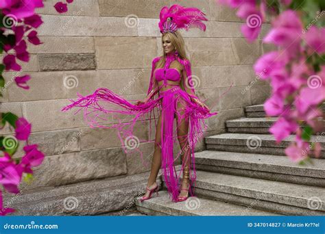 Blonde Goddess With Long Legs In Pink Macrame Dress Sensually Walks Around The City Stock Image