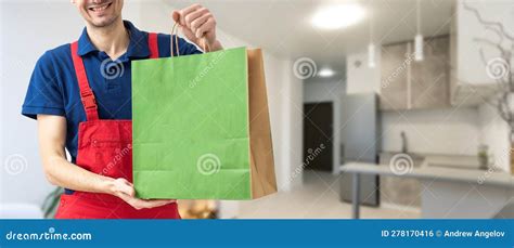 Box With Fast Food Being Carried By Delivery Man In Uniform For One Of