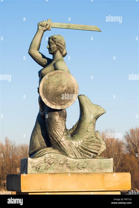 The Warsaw Mermaid Called Syrenka On The Vistula River Bank In Poland