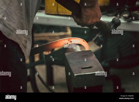 A Blacksmith Hammering Hot Iron Stock Photo Alamy