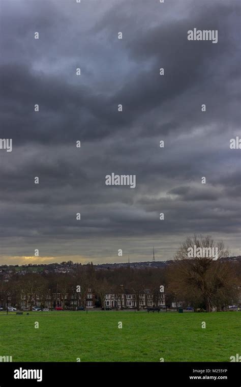 Sun Rays Shining Through The Clouds Hilly Fields Brockley Stock Photo