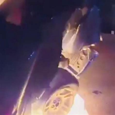 Police Officers Rush To Pull Woman Trapped In Burning Vehicle To Safety