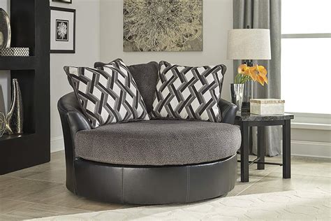 oversized swivel barrel chair with faux leather upholstery matching accent pillows for living ...