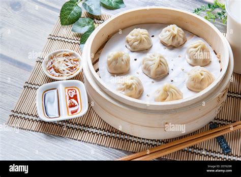 Steamed Xiaolongbao Served In A Traditional Steaming Basket Stock Photo