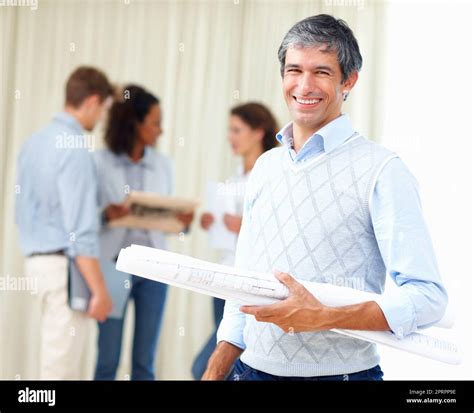 Smiling Business Man Holding Blueprint Portrait Of Mature Business Man