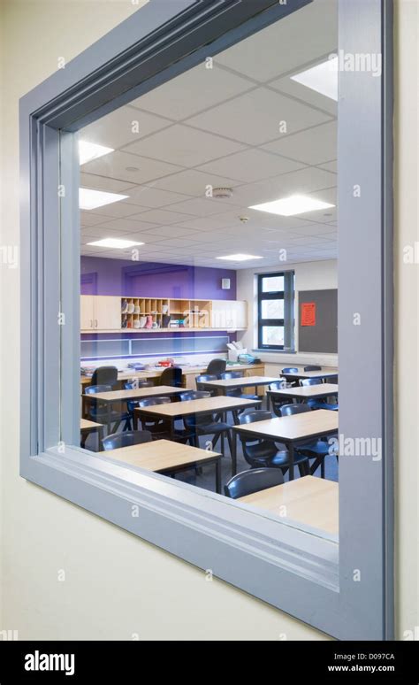 Looking Through A Window From The Corridor Into A Classroom Of A Modern Secondary School Stock