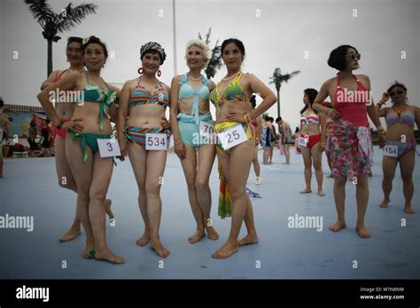 Elderly Chinese Women Dressed In Bikini Pose During A Middle Aged And