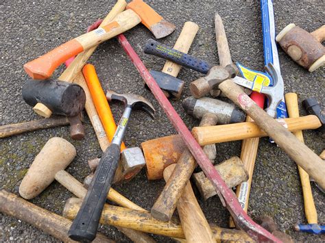 A Group Of Various Hammers Mallets And Axes