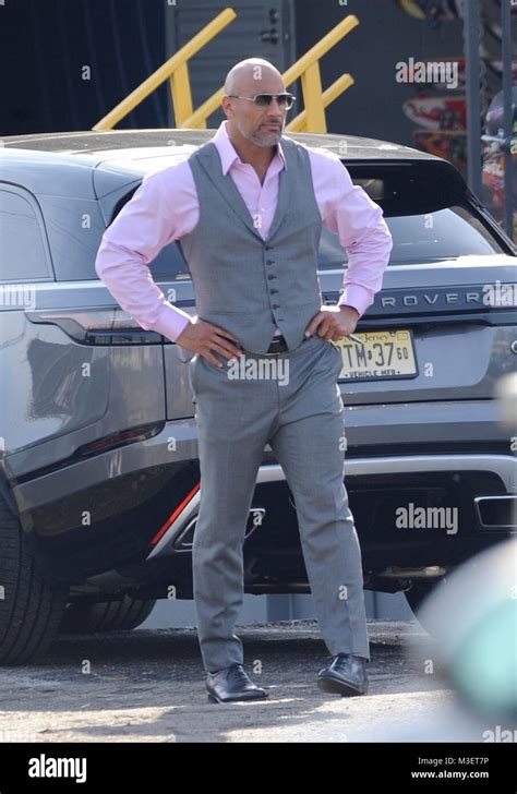 Actor Dwayne Johnson Strikes A Pose While Filming A Scene For The Hit