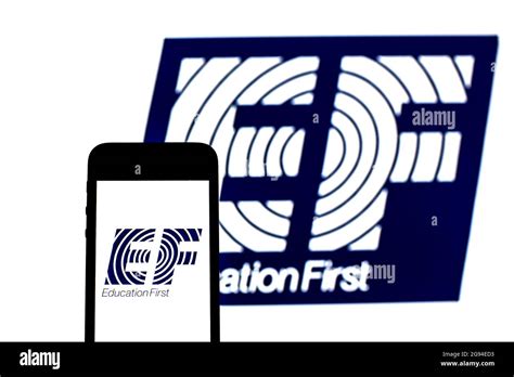 In this photo illustration an EF Education First logo seen displayed on ...
