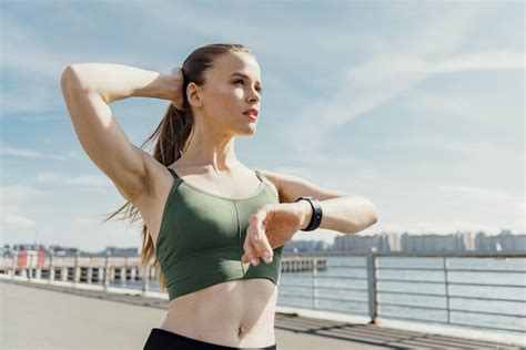 Premium Photo Athletic Woman Stretching Her Arm Wearing A Fitness