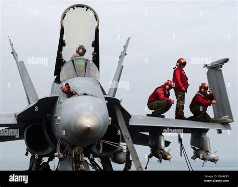 US Navy Sailors Assigned To The Bulls Of Strike Fighter Squadron Three