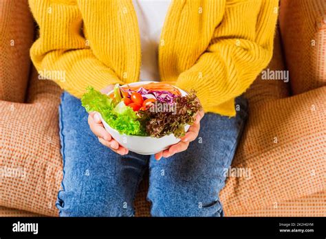 Female Hands Holding Bowl With Green Lettuce Salad Stock Photo Alamy