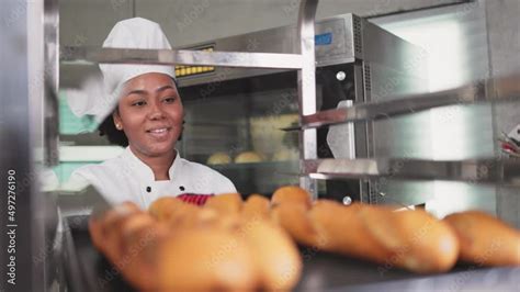 Smiling African Female Bakers Looking At Camera Chefs Baker In A Chef