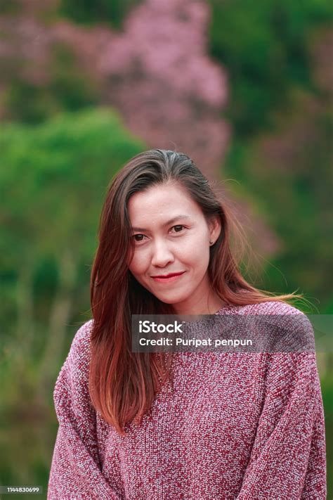 Women Wearing Pink Shirts Are Happily Smiling Stock Photo Download