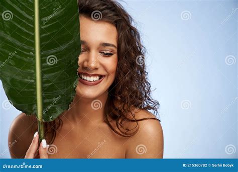 Naked Woman Laughing Hiding Face Behind Green Leaf Stock Photo