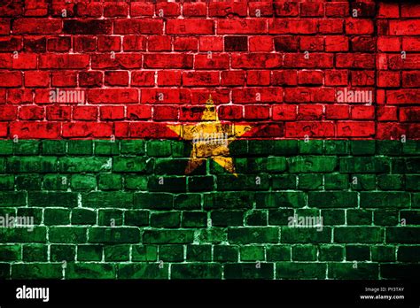 National Flag Of Burkina Faso On A Brick Background Concept Image For