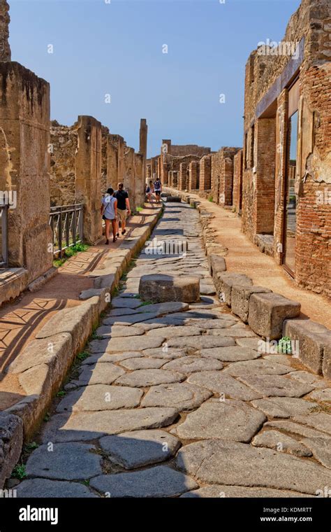 Streets With Stepping Stones In The Ruined Roman City Of Pompeii At