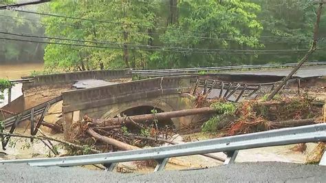 Connecticut Residents Clean Up After Heavy Rain Washes Away Roads
