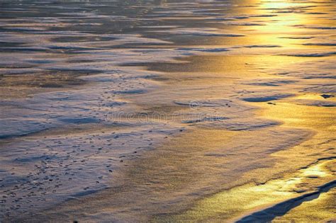 Winter Landscape Of Frozen Lake On Sunset Snow Ice And Puddles Many