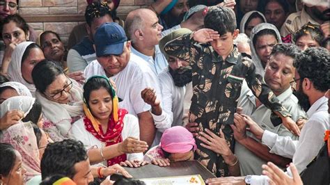 Last salute: 7-year-old son in army fatigues lights Col Manpreet Singh ...