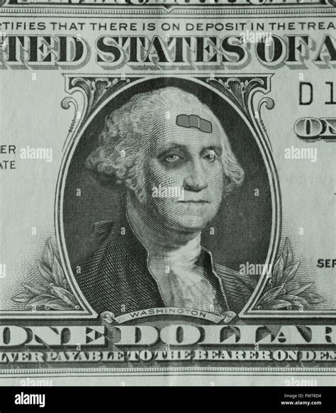 George Washington on a dollar bill is sporting a black eye and a band-aid, as the weak dollar ...