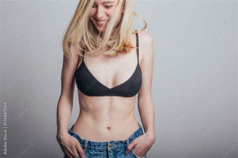 Sexy Blonde Woman In Jeans And Black Bra Stock Photo Adobe Stock