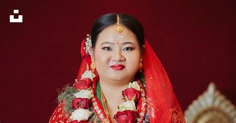 A Woman In A Red And Gold Wedding Outfit Photo Free Nepal Image On Unsplash