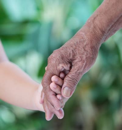 Old And Young Holding Hands Stock Photo - Download Image Now - iStock