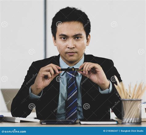 Adult Asian Businessman Are Office People Sitting With Carm Face He