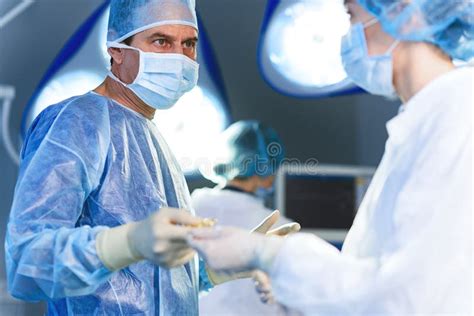 Serious Doctor In Operating Theatre Stock Photo Image Of Emergency