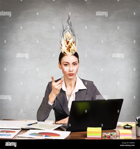 Woman Having Her Brain On Fire Because Of Stress On A Gray Background