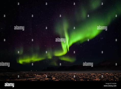 Aurora Borealis Viewed From The Small Arctic Town Of Pangnirtung Over